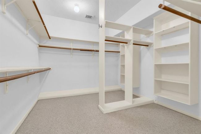Primary bedroom walk in closet. | Image 19