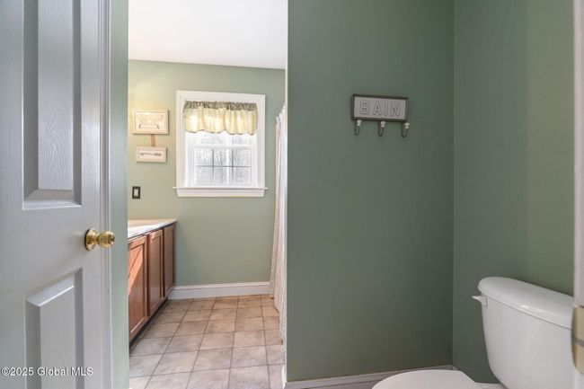 2nd Floor Full Bath featuring double vanity, tub/shower and separate toilet area | Image 33