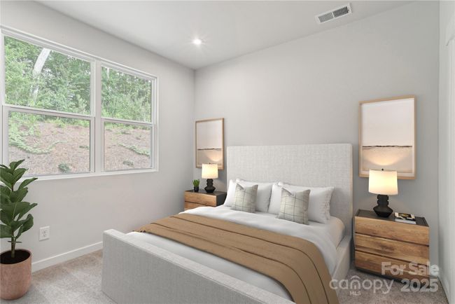 *Virtually staged representative of the Norman floorplan – not the actual home* Primary Suite on the main floor. | Image 4