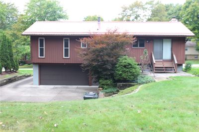 View of front of property featuring a garage and a front lawn | Image 2