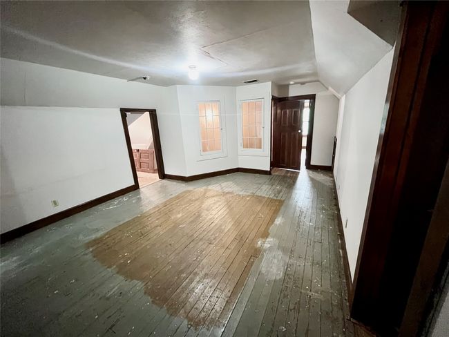 Additional living space with wood floors and vaulted ceiling | Image 15