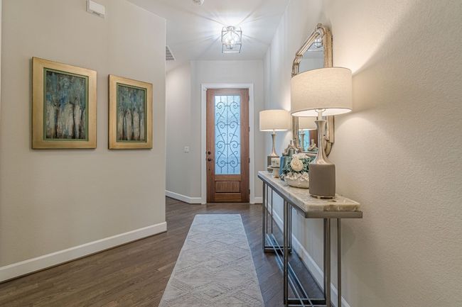 Foyer with dark wood-style floors and baseboards | Image 6