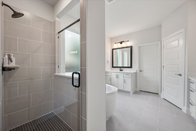 The primary en suite bathroom offers a stand-in shower. | Image 23