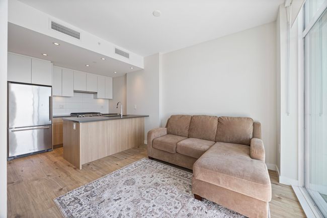 Living room with visible vents, recessed lighting, and light wood finished floors | Image 4