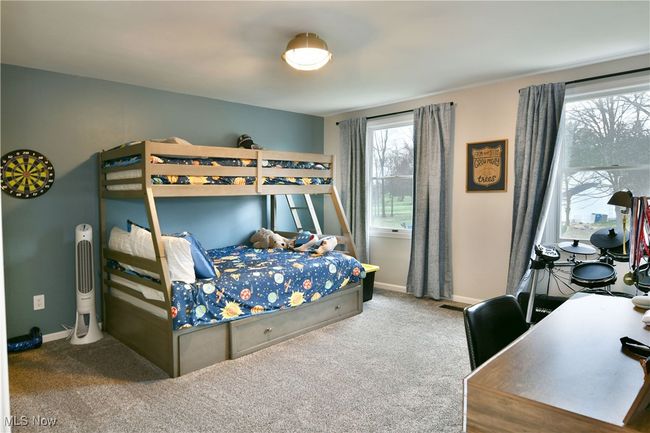 Bedroom featuring baseboards and carpet flooring | Image 39