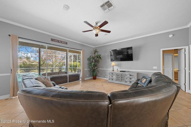 Great room with triple sliders to the pool | Image 11
