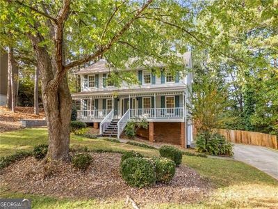 Colonial home featuring a porch | Image 1