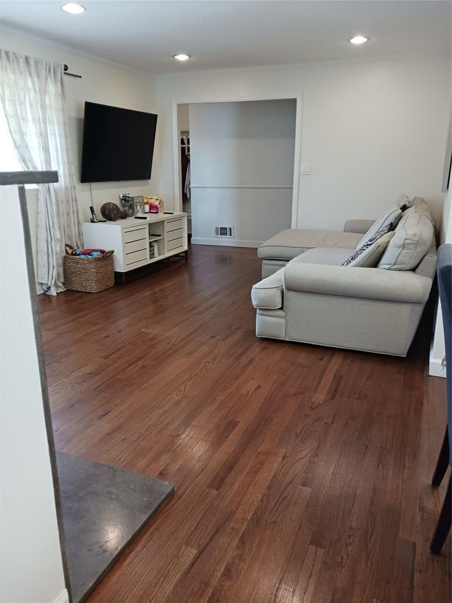 Living room with visible vents, recessed lighting, and dark wood finished floors | Image 11