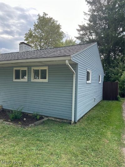 View of side of home featuring a yard | Image 3