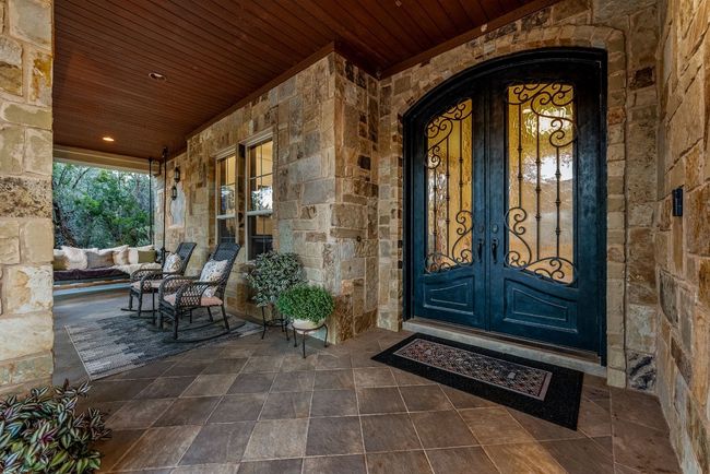 Front entrance with a spacious porch and extra room for family and friends to relax. | Image 5