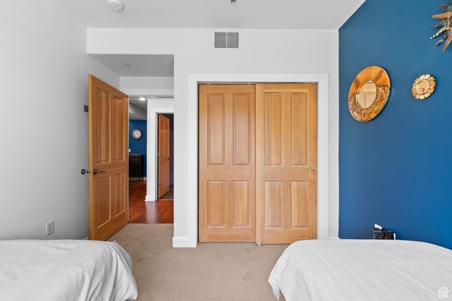 Carpeted bedroom featuring a closet | Image 22
