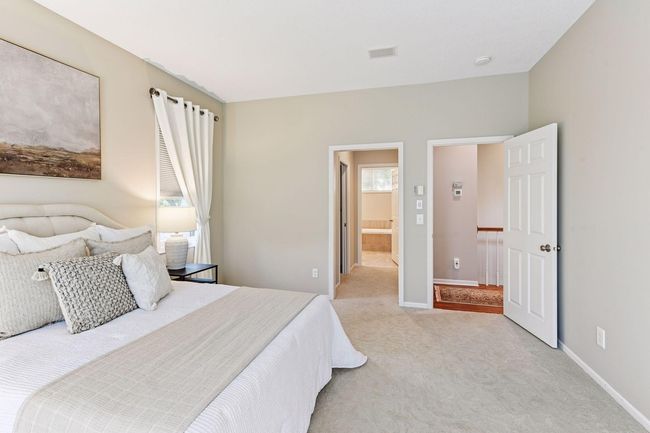 Relax and recharge in a spacious, serene primary retreat. | Image 41