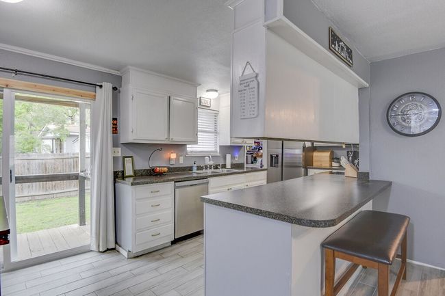 Enjoy your coffee at the breakfast bar or on the back porch. | Image 10