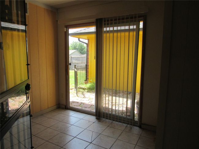 Doorway to outside with light tile patterned floors | Image 28