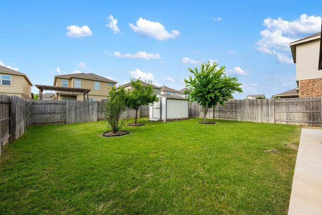 View of yard with a shed and an outbuilding | Image 36