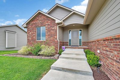 View of exterior entry featuring a lawn | Image 3