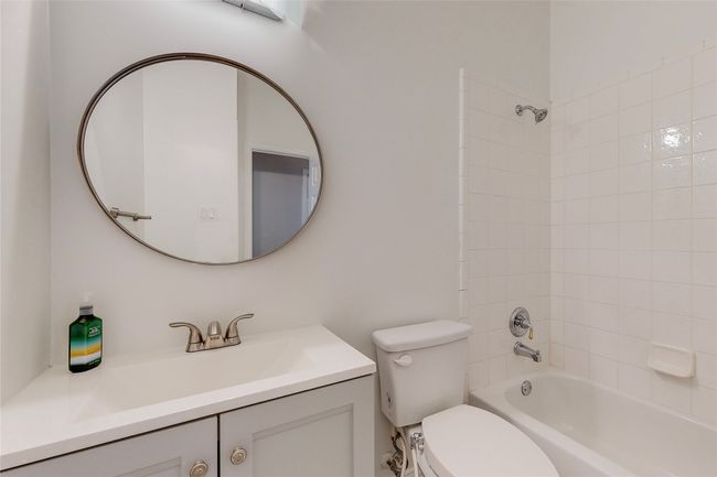 Full bathroom with toilet, vanity, and tub / shower combination | Image 33