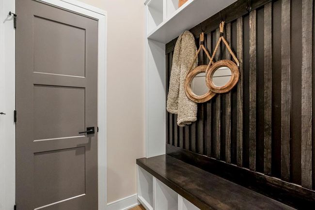 Mud Room with boot bench. Photos of previous model home. Not actual listing. Features and sizes may vary. Contact agent for details & showings! | Image 13