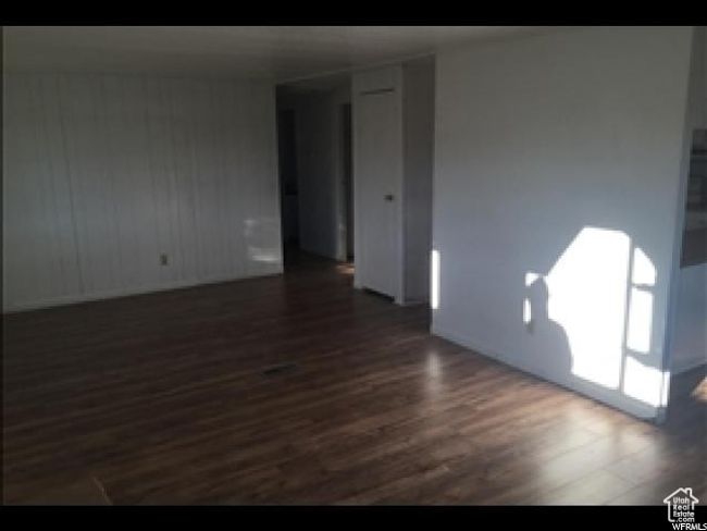 Unfurnished room featuring dark wood-type flooring | Image 42