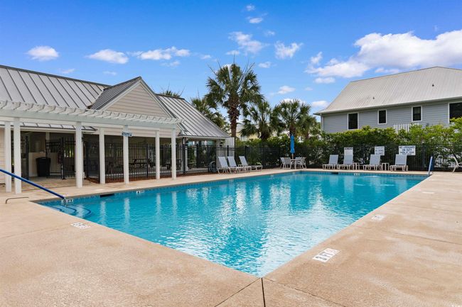 Community pool featuring a pergola and a patio | Image 36