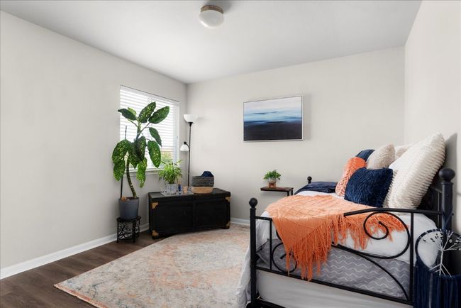 Bedroom featuring baseboards and wood finished floors | Image 24