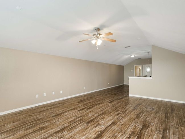 Bonus room with ceiling fan, wood finished floors, and lofted ceiling | Image 33