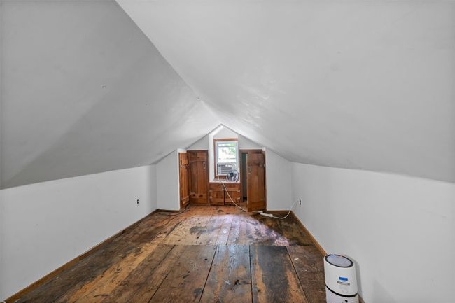 Bonus room with hardwood / wood-style flooring, lofted ceiling, and baseboards | Image 15
