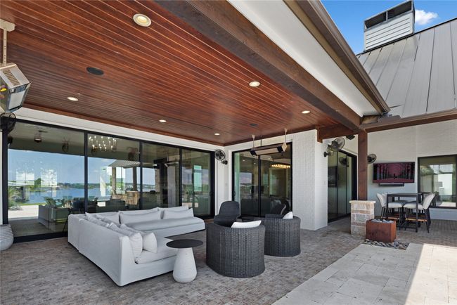 View of patio featuring an outdoor hangout area and outdoor dining area | Image 37