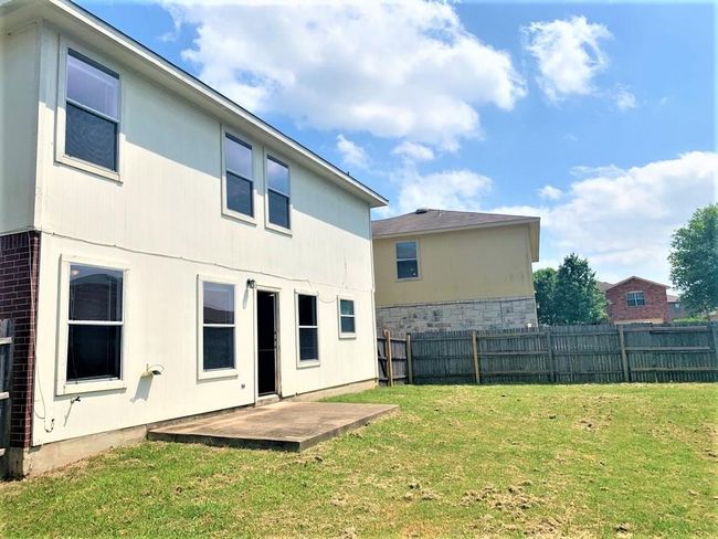 Back of property with a fenced backyard and a patio | Image 27