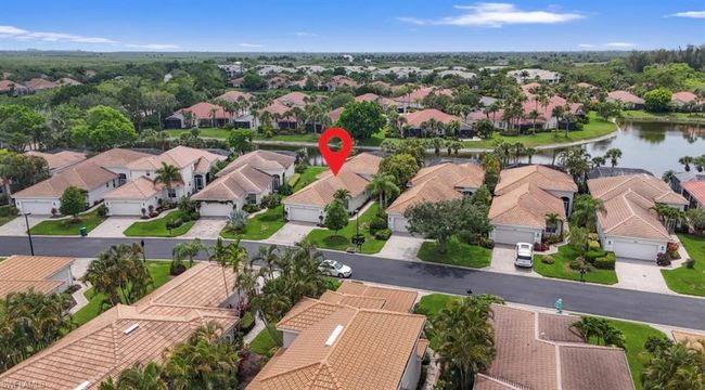 Aerial perspective of suburban area with a nearby body of water | Image 5