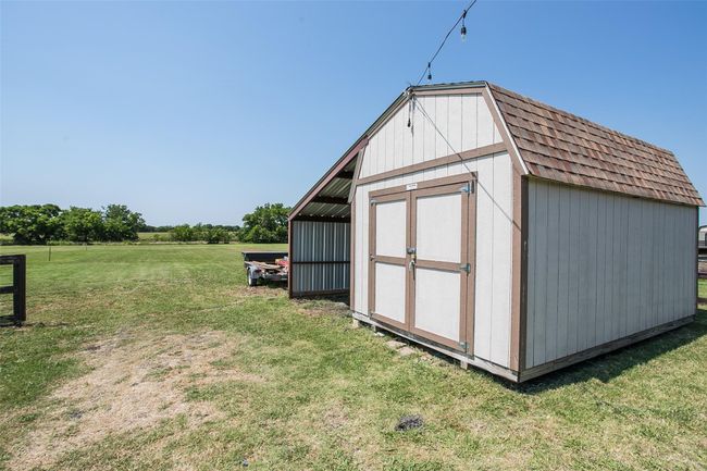 Large storage barn with a carport for a small boat, small car or your riding lawn mower. | Image 28