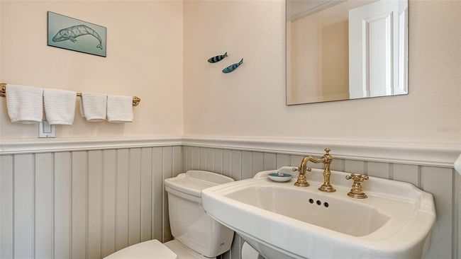Powder room off foyer | Image 44