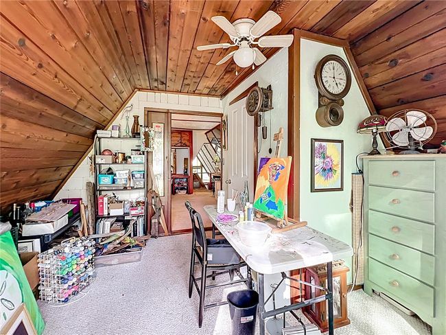 2nd loft room currently being utilized as an art studio, Door near center leads to the 1/2 bath. | Image 34