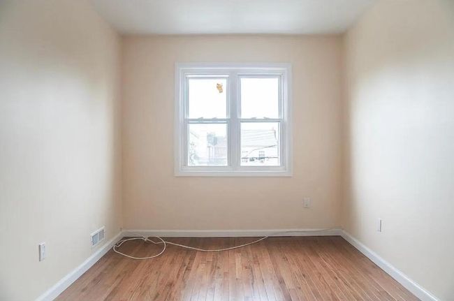 Unfurnished room featuring baseboards, visible vents, and light wood-style flooring | Image 9