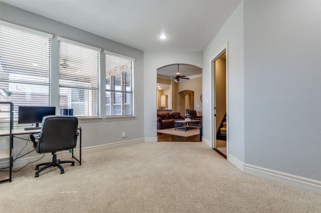 Home office featuring arched walkways, recessed lighting, baseboards, and carpet floors | Image 21