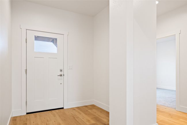 Foyer entrance with light wood-style floors and baseboards | Image 5