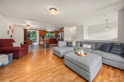 Split Level Entry; Upper Level living room, dining area and kitchen. | Image 2