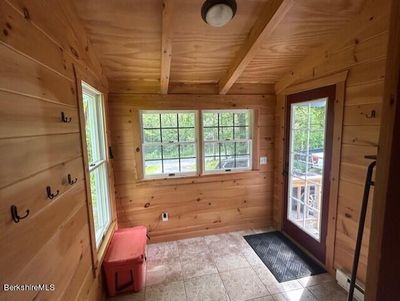 Lovely pine entrance to a heated mud room | Image 2