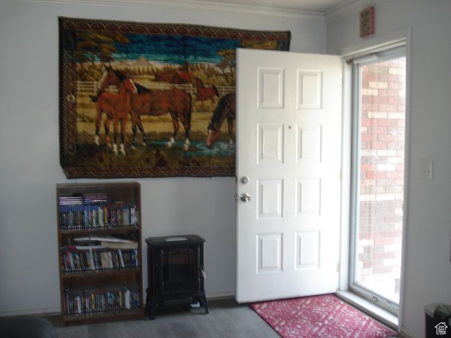 Entryway with crown molding and wood finished floors | Image 4
