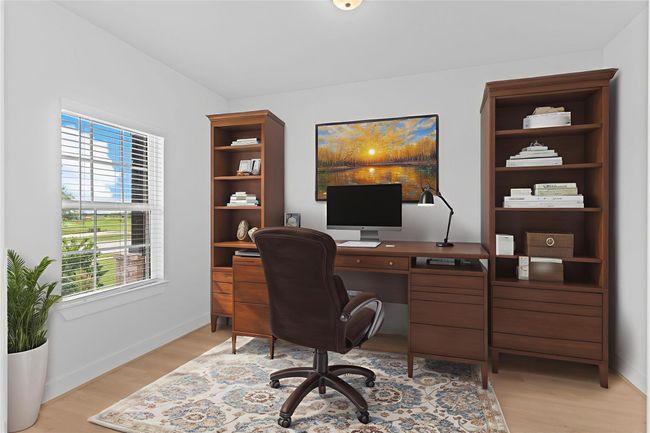 Double doors open to a dedicated home office or study nestled at the front of the home—an ideal space for productivity, quiet focus, or creative inspiration. *Virtually Staged Photo* **Image Representative of Plan Only and May Vary as Built**. | Image 5