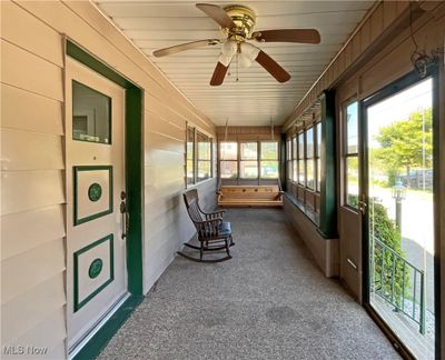 Sunroom featuring ceiling fan | Image 2