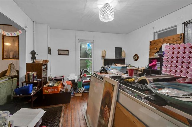 Office featuring wood-type flooring | Image 5