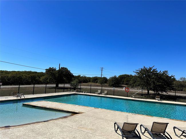 Pool with a patio and fence | Image 4