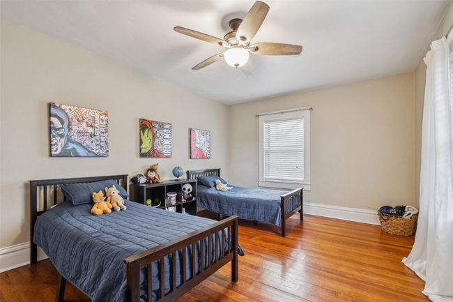 Bedroom with hardwood / wood-style floors and a ceiling fan | Image 27