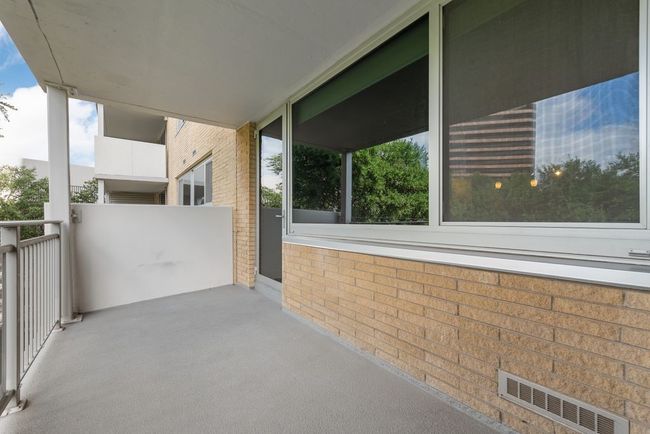 Unit's expansive balcony provides private exterior living space. | Image 16