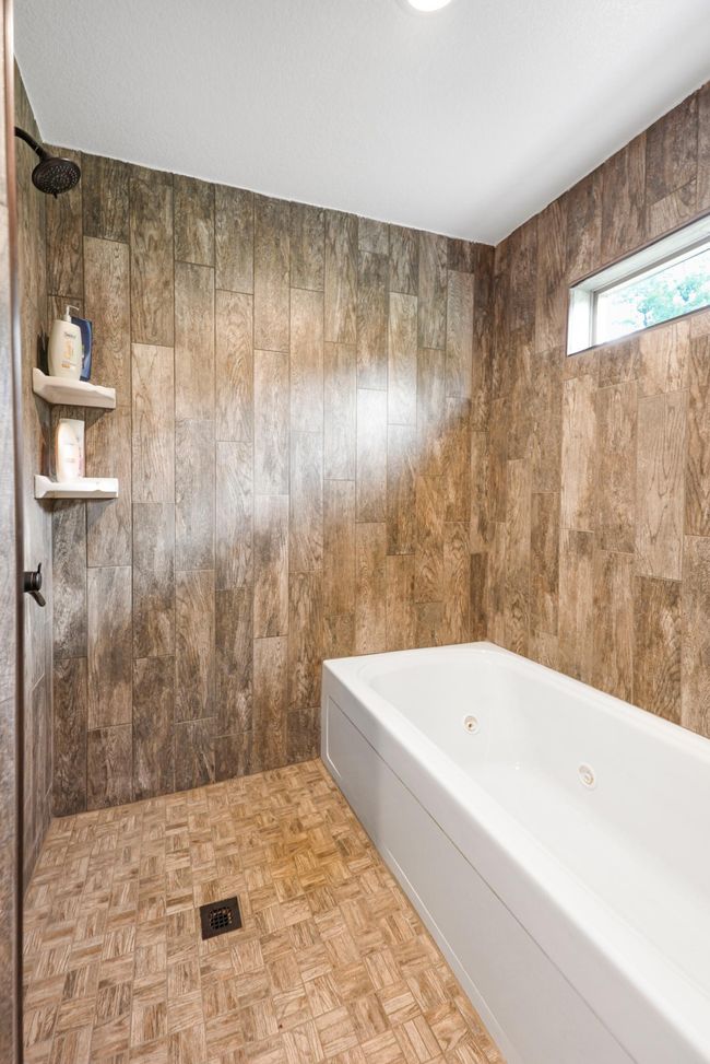 Integrated shower & tub in wet room. | Image 26