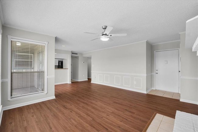 Living room goals: where the kitchen’s in view, the sunlight’s streaming in, and the fireplace is giving cozy | Image 5