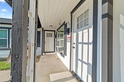 View of exterior entry with a porch and cooling unit | Image 3