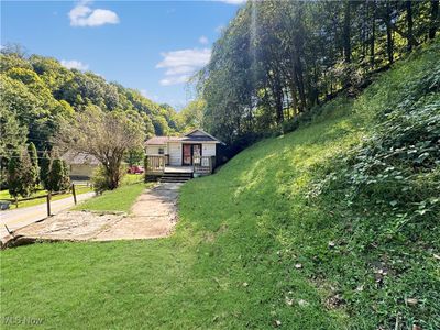 View of yard featuring a deck | Image 2