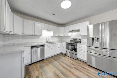 Updated Kitchen, New Stainless Appliances, Counter Tops and Tile Back Splash | Image 2